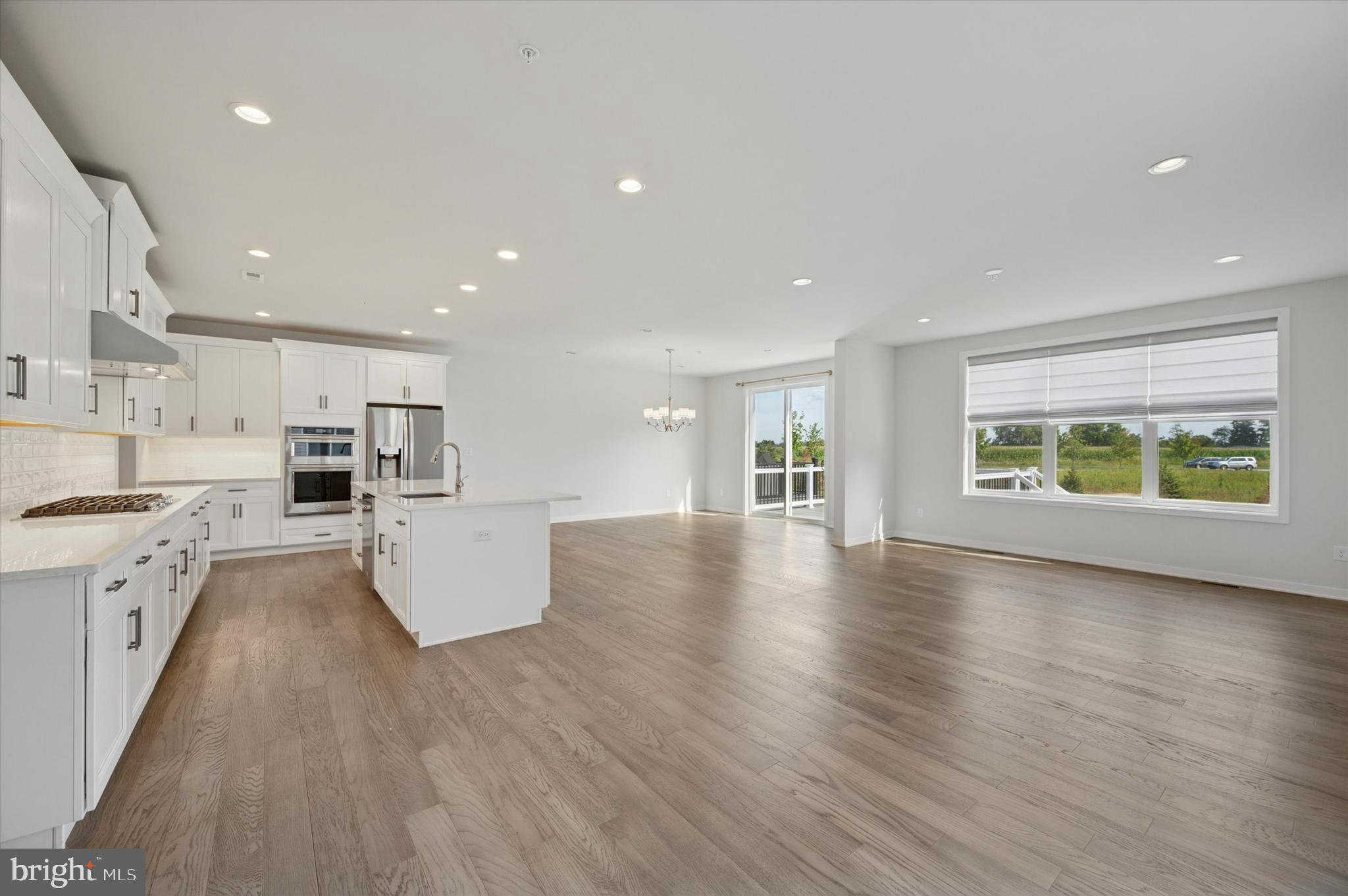 3174 Wier Drive East, Unit E Warrington, PA 18976 - Photo 6 of 37 a view of kitchen with kitchen island wooden floors and stainless steel appliances