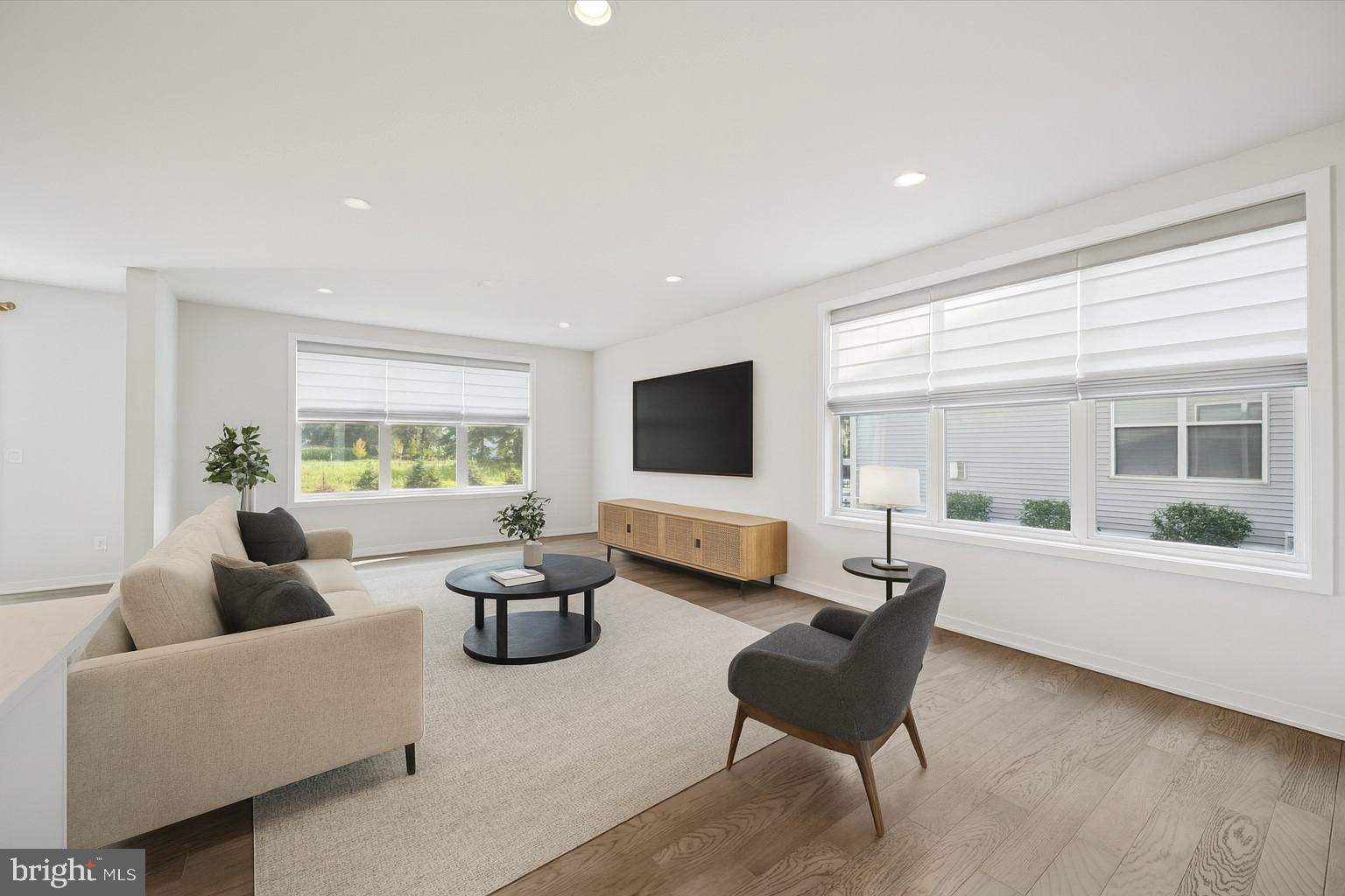 3174 Wier Drive East, Unit E Warrington, PA 18976 - Photo 8 of 37 a living room with furniture and a flat screen tv