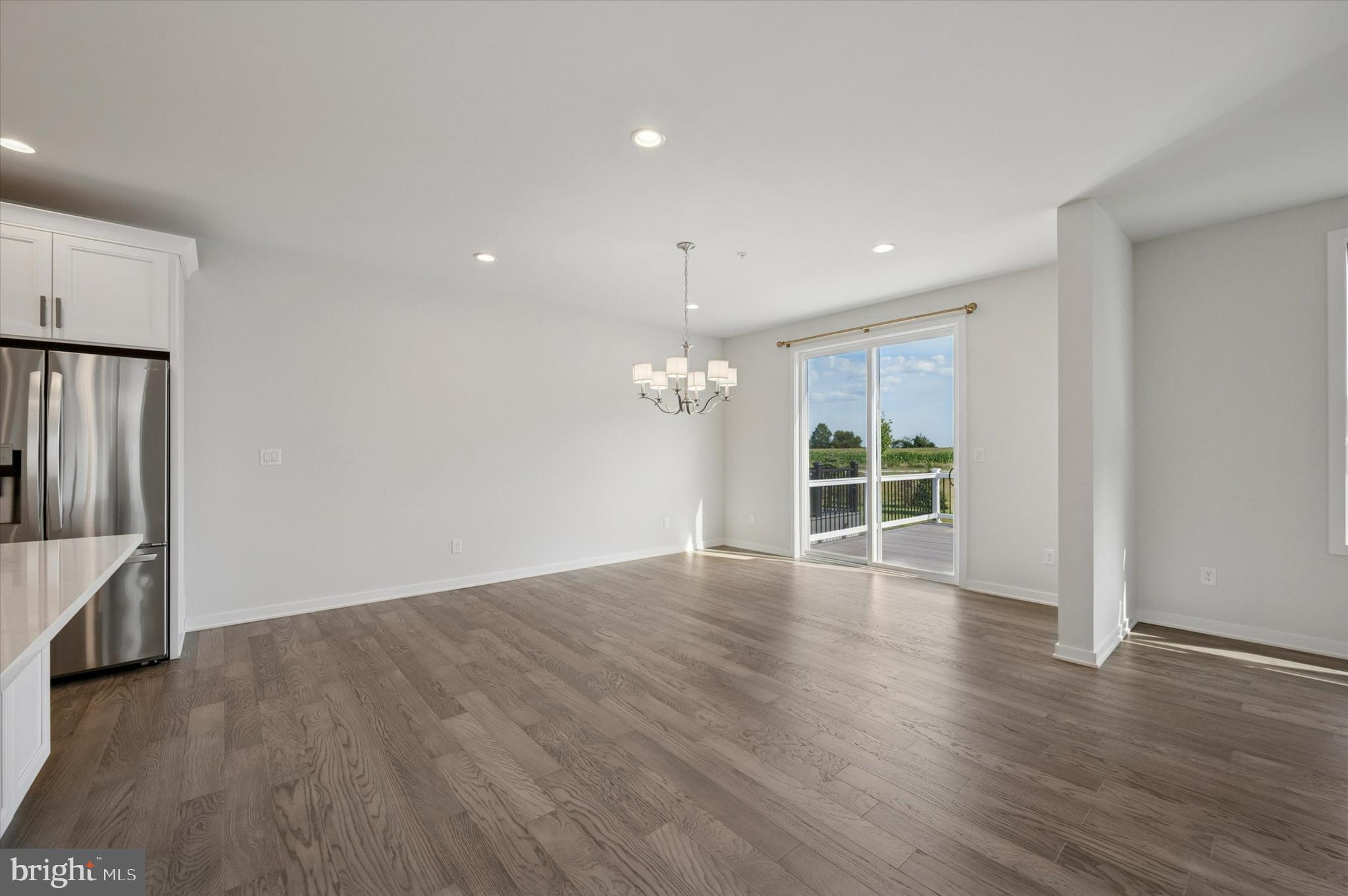 3174 Wier Drive East, Unit E Warrington, PA 18976 - Photo 9 of 37 a view of an empty room with wooden floor and a window