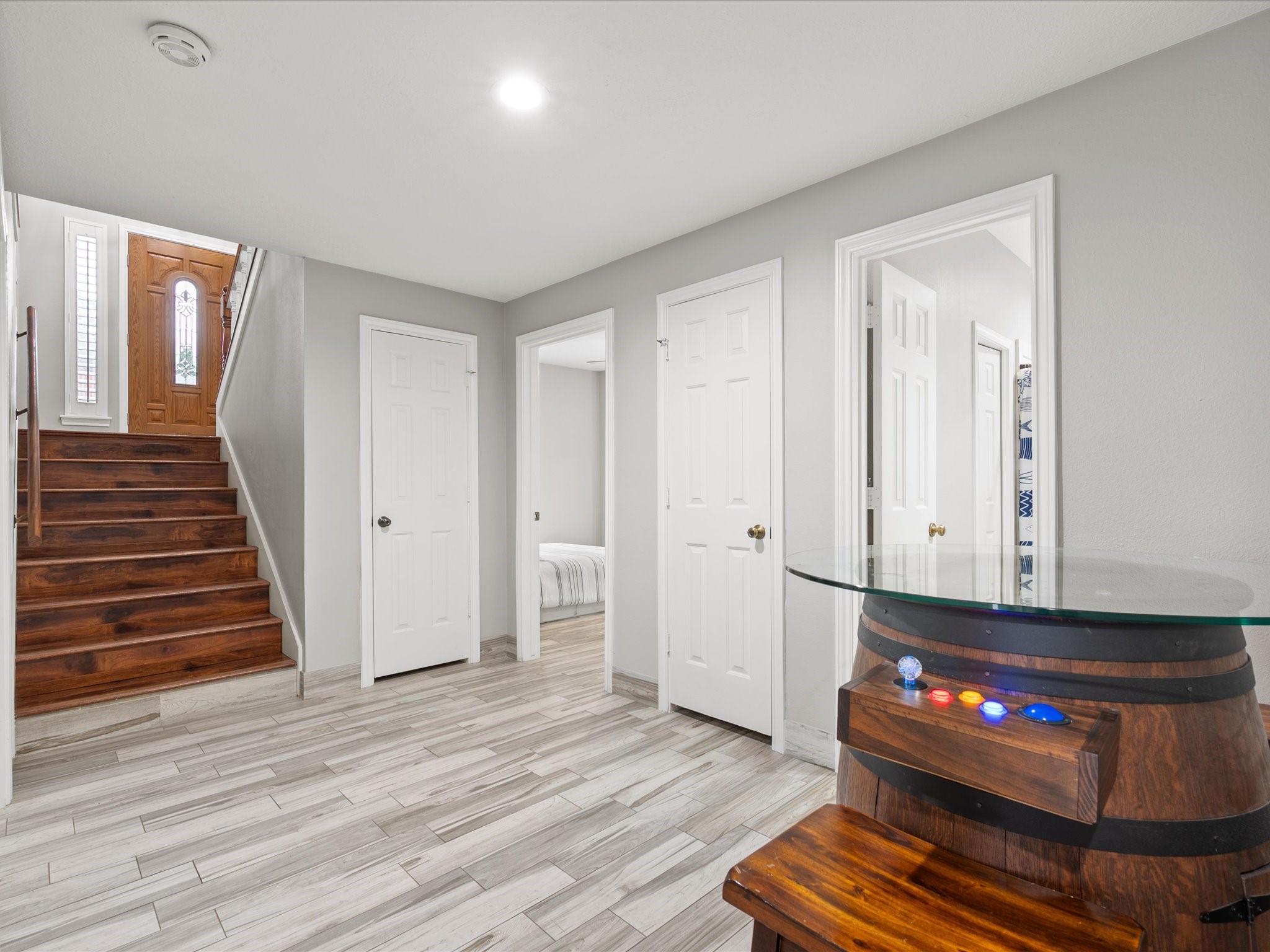 2906 Penninsula Point Montgomery, TX 77356 - Photo 23 of 48 The versatile downstairs flex
space is perfect for a game
room, media area, or second
living room. With direct access to
the pool, backyard, and covered
patio, it seamlessly blends
indoor comfort with outdoor
entertainment, making it ideal for
both relaxation and lively
gatherings.