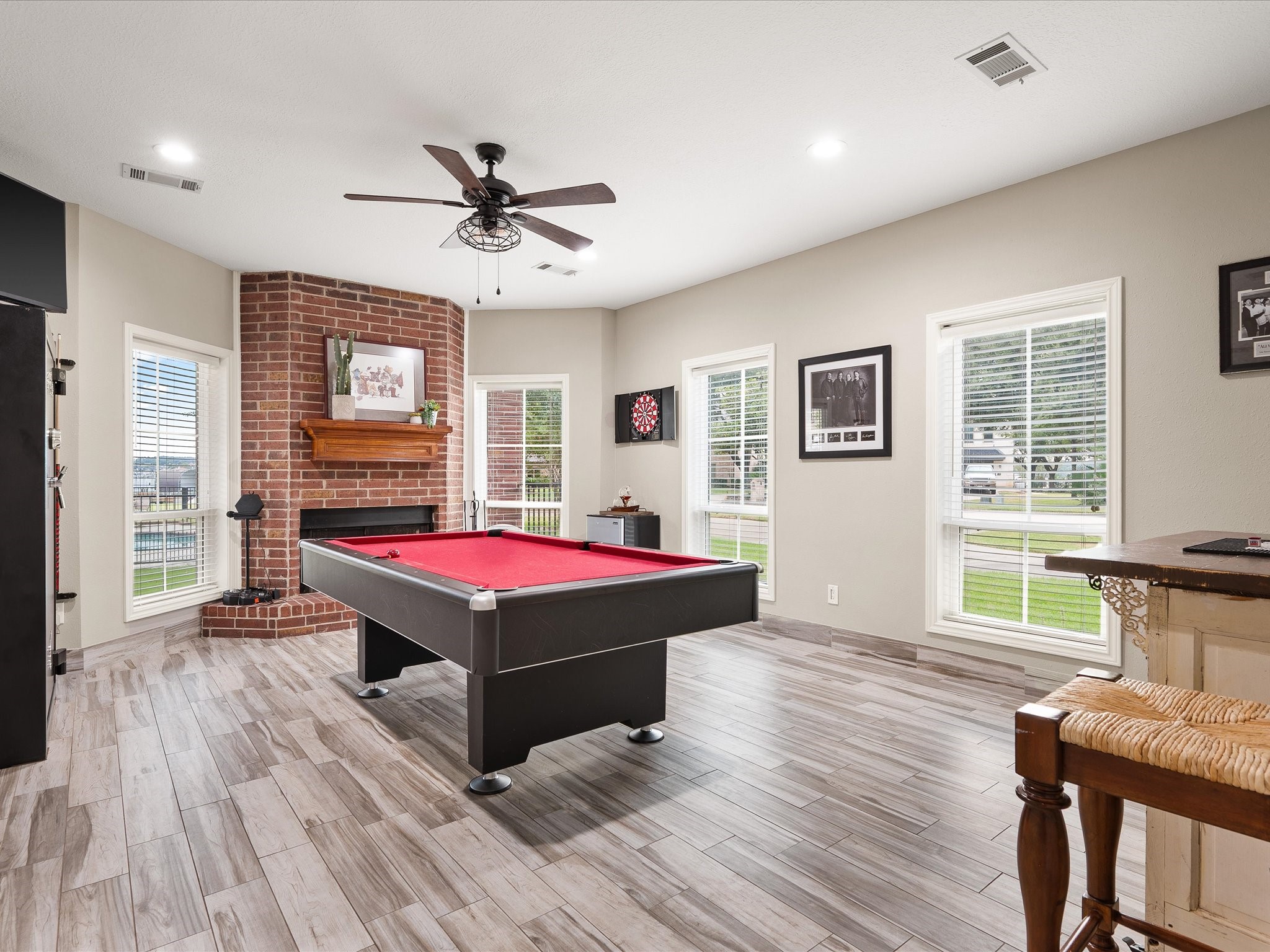 2906 Penninsula Point Montgomery, TX 77356 - Photo 24 of 48 The versatile downstairs flex
space is perfect for a game
room, media area, or second
living room. With direct access to
the pool, backyard, and covered
patio, it seamlessly blends
indoor comfort with outdoor
entertainment, making it ideal for
both relaxation and lively
gatherings.