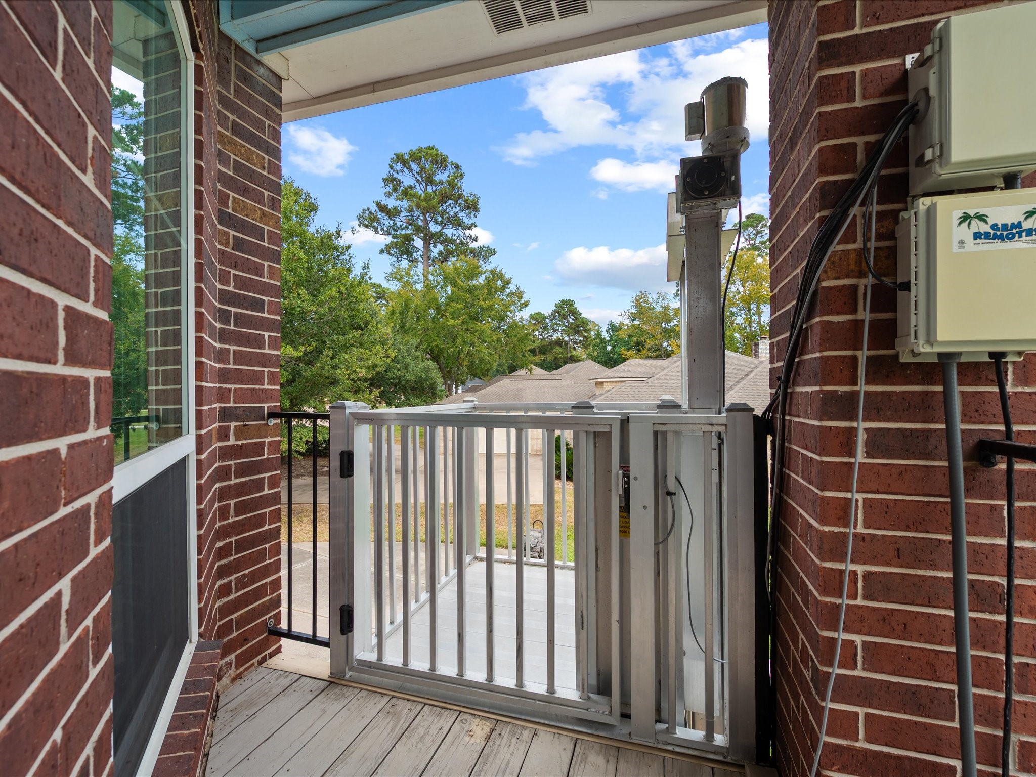 2906 Penninsula Point Montgomery, TX 77356 - Photo 31 of 48 Experience effortless luxury with
the outdoor lift elevator,
providing direct access from the
poolside on the ground floor to
the upstairs balcony. Enjoy
seamless convenience and
sophisticated design without
ever needing to step inside,
perfectly blending functionality
with upscale living.