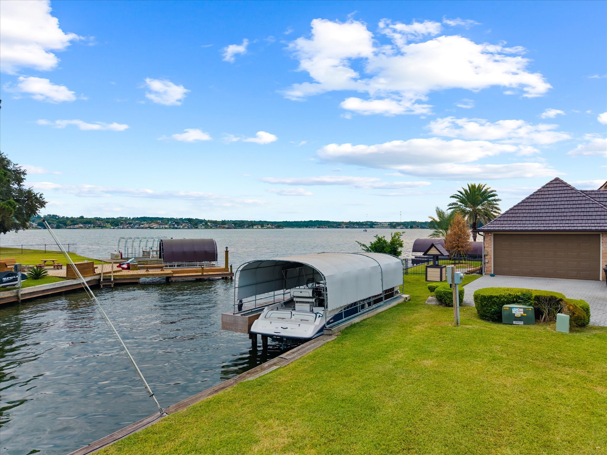 2906 Penninsula Point Montgomery, TX 77356 - Photo 43 of 48 You couldn’t truly be living
lakeside without your very own
boat slip. This private slip
accommodates up to a pontoon
and features an electric boat lift
—perfect for effortless lake
access and enjoying the ultimate
waterfront lifestyle.