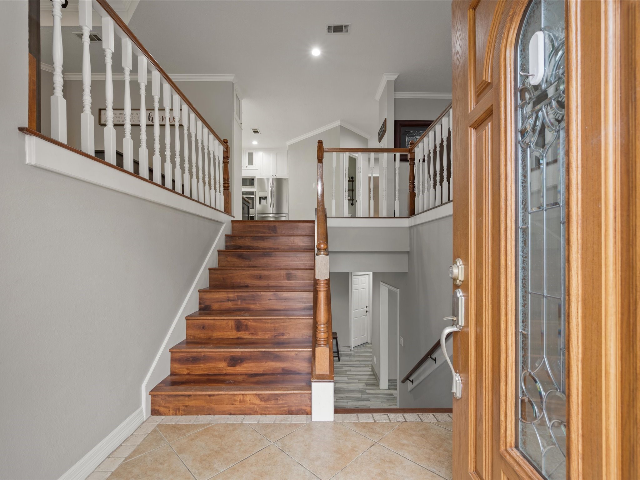 2906 Penninsula Point Montgomery, TX 77356 - Photo 7 of 48 Step inside to a grand split-level
staircase that defines the heart
of the home — an architectural
statement that combines
elegance and function. Its open
design beautifully divides the
space, creating a seamless flow
ideal for entertaining, gathering,
and unwinding in style.