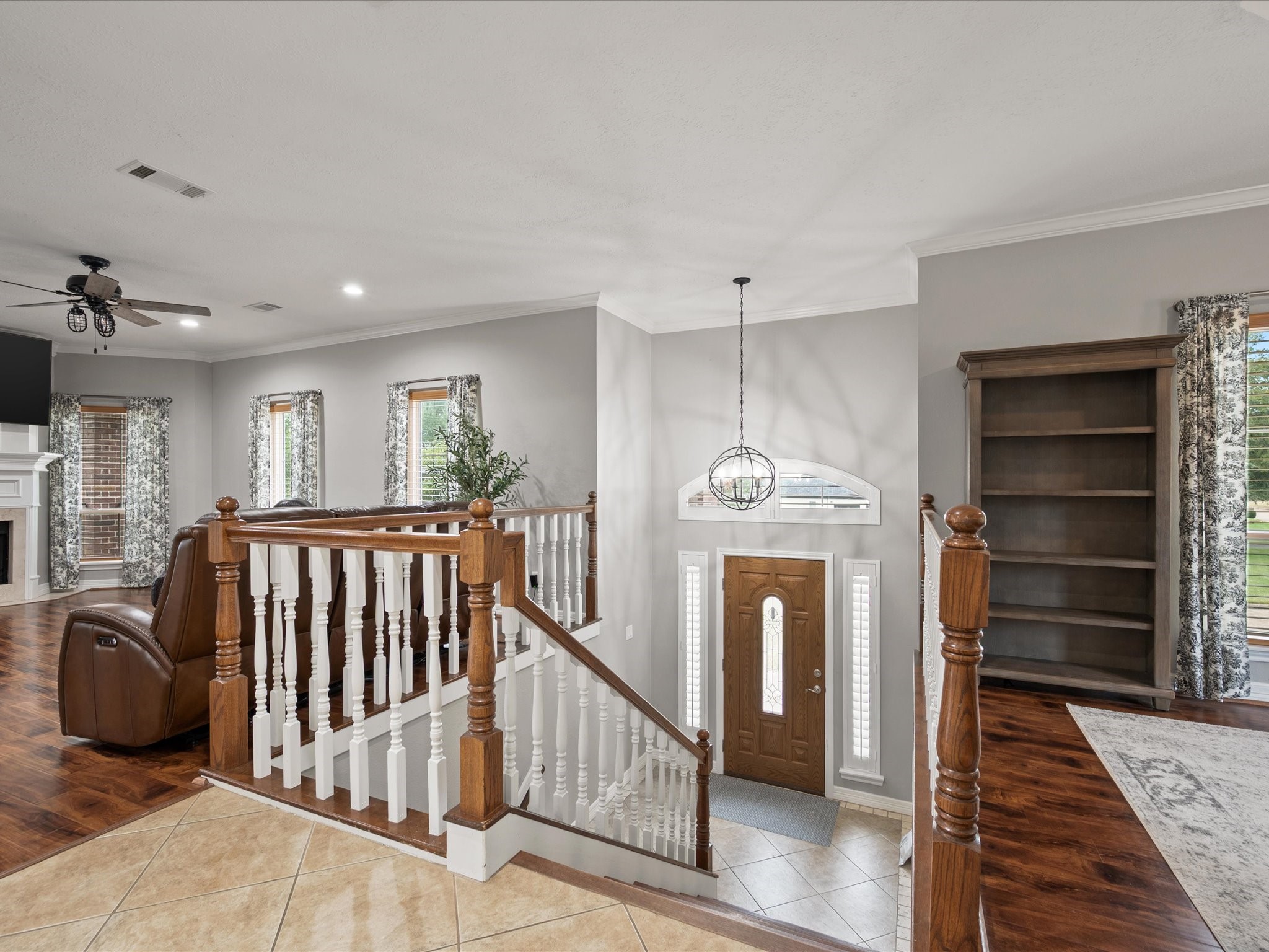 2906 Penninsula Point Montgomery, TX 77356 - Photo 8 of 48 The grand entryway and
sweeping staircase create an
unforgettable welcome, blending
timeless elegance with a sense
of refined comfort.