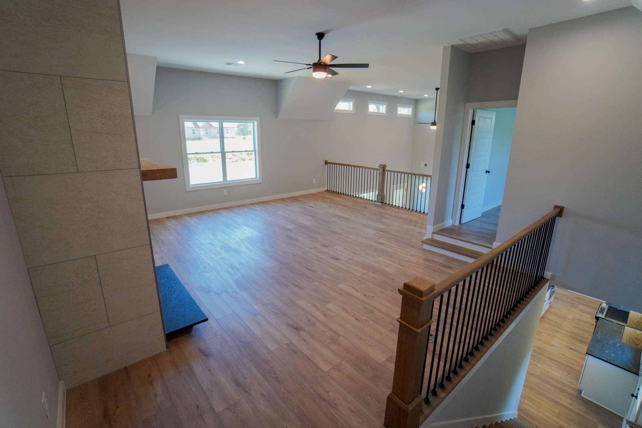 3035 Wixtown Road Westmoreland, TN 37186 - Photo 3 of 8 a view of a livingroom with wooden floor and stairs