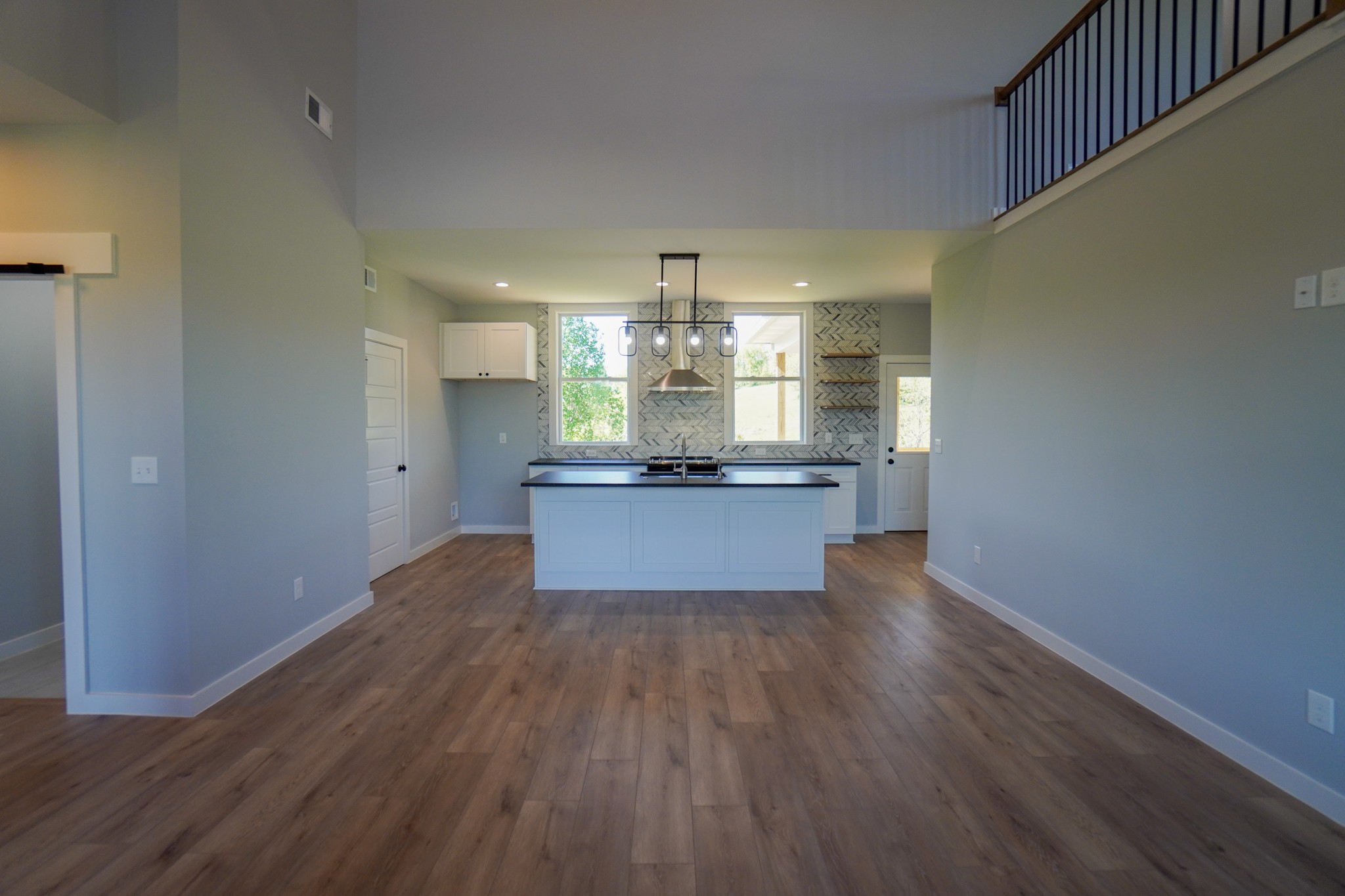 3035 Wixtown Road Westmoreland, TN 37186 - Photo 6 of 8 a view of a kitchen with a sink wooden floor and a kitchen