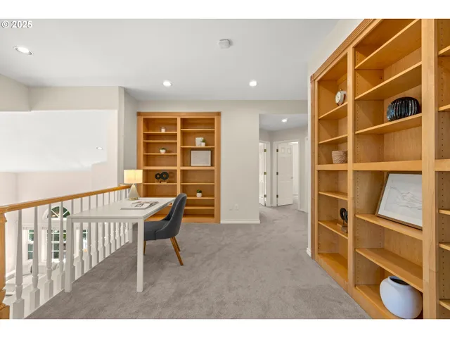 a view of workspace with wooden floor and windows