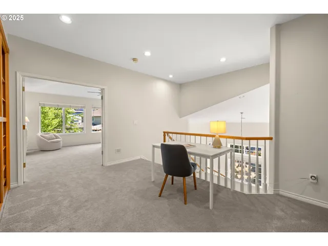 a view of an chairs and table in a room