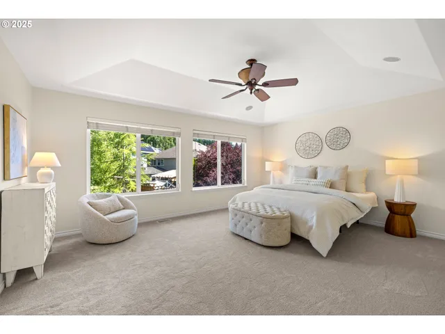 a bedroom with a large bed and a window