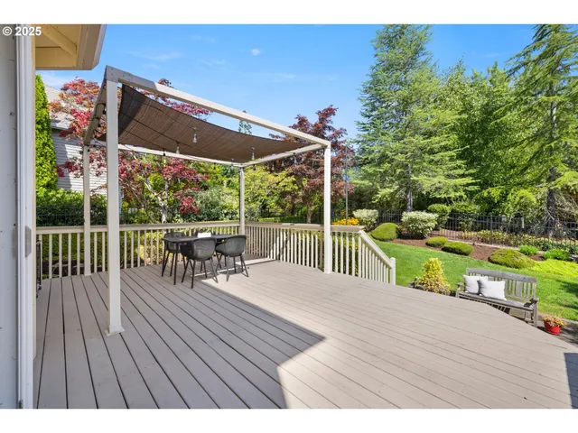 a view of a deck with wooden floor and outdoor seating