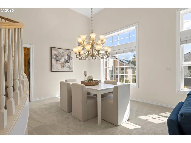 a view of kitchen with windows and refrigerator