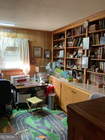 a view of a workspace with furniture