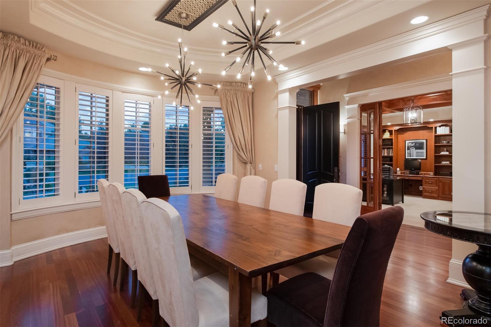 3 Sandy Lake Road Englewood, CO 80113 - Photo 12 of 35 a view of a dining room with furniture window and wooden floor