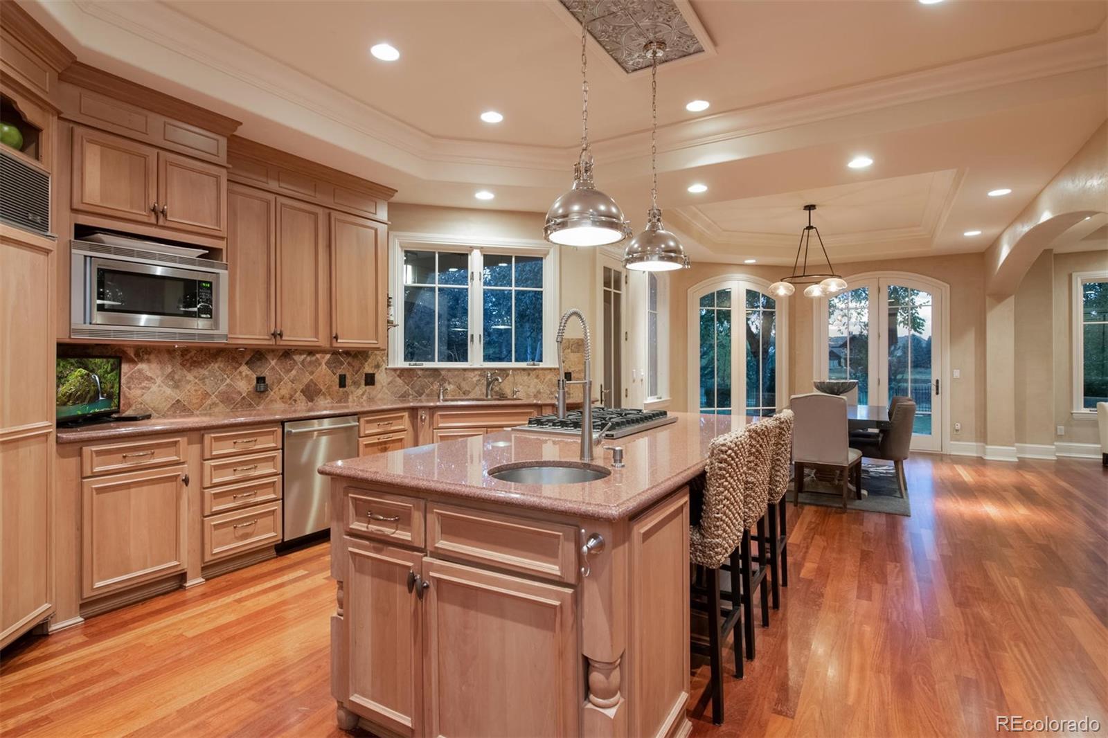 3 Sandy Lake Road Englewood, CO 80113 - Photo 13 of 35 a kitchen with a sink stove and cabinets