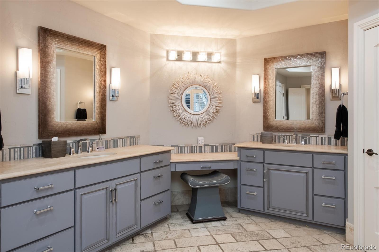 3 Sandy Lake Road Englewood, CO 80113 - Photo 21 of 35 a bathroom with a granite countertop sink mirror and toilet