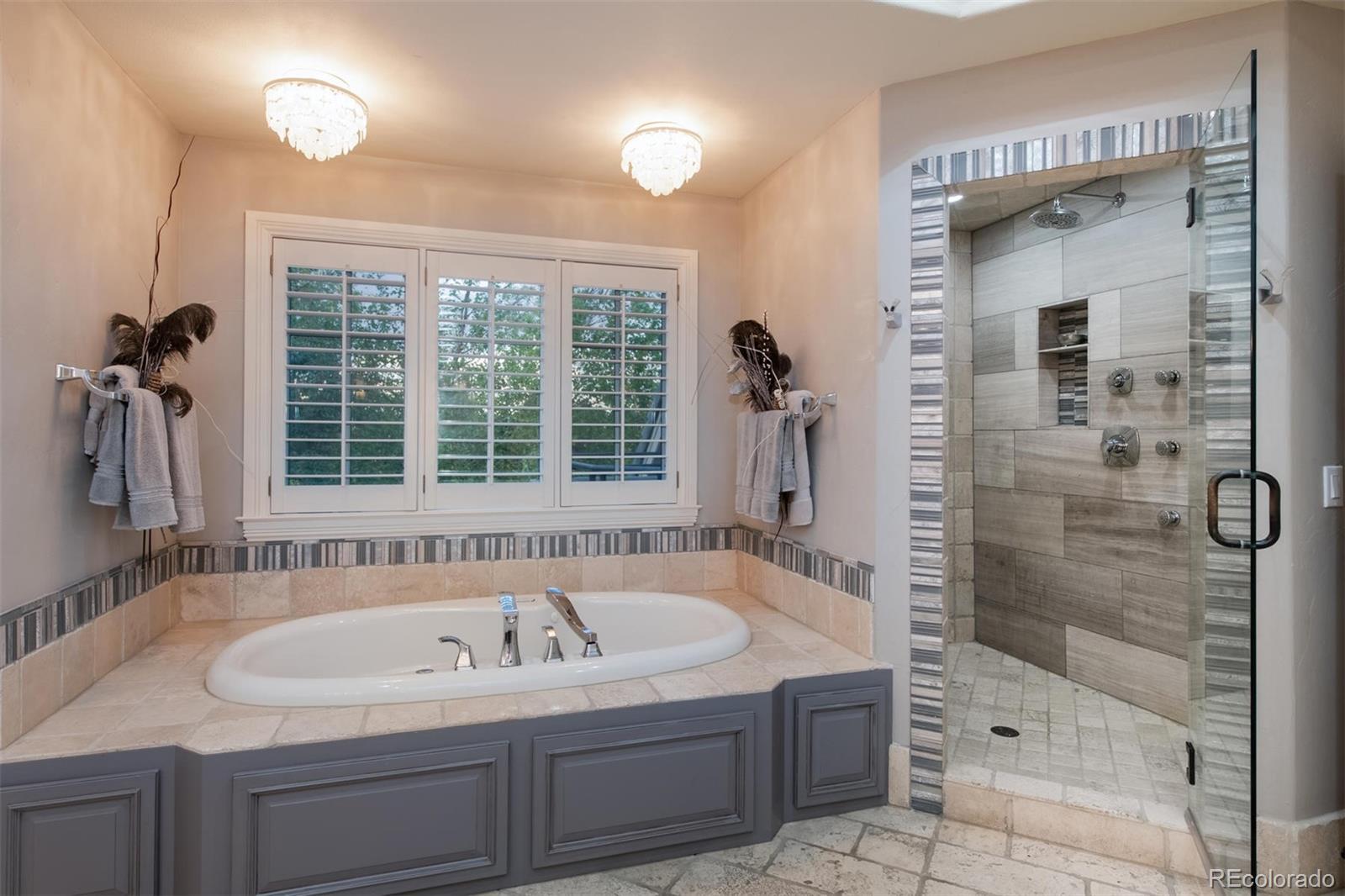 3 Sandy Lake Road Englewood, CO 80113 - Photo 22 of 35 a bathroom with a sink and a shower