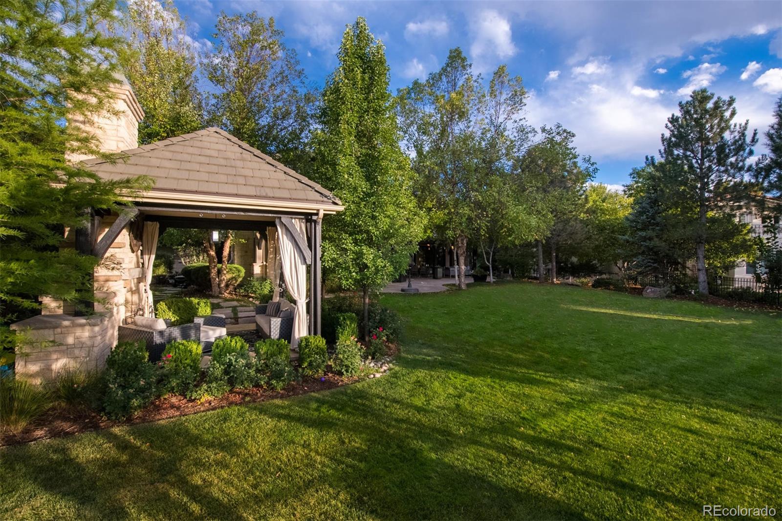3 Sandy Lake Road Englewood, CO 80113 - Photo 30 of 35 a backyard of a house with lots of green space