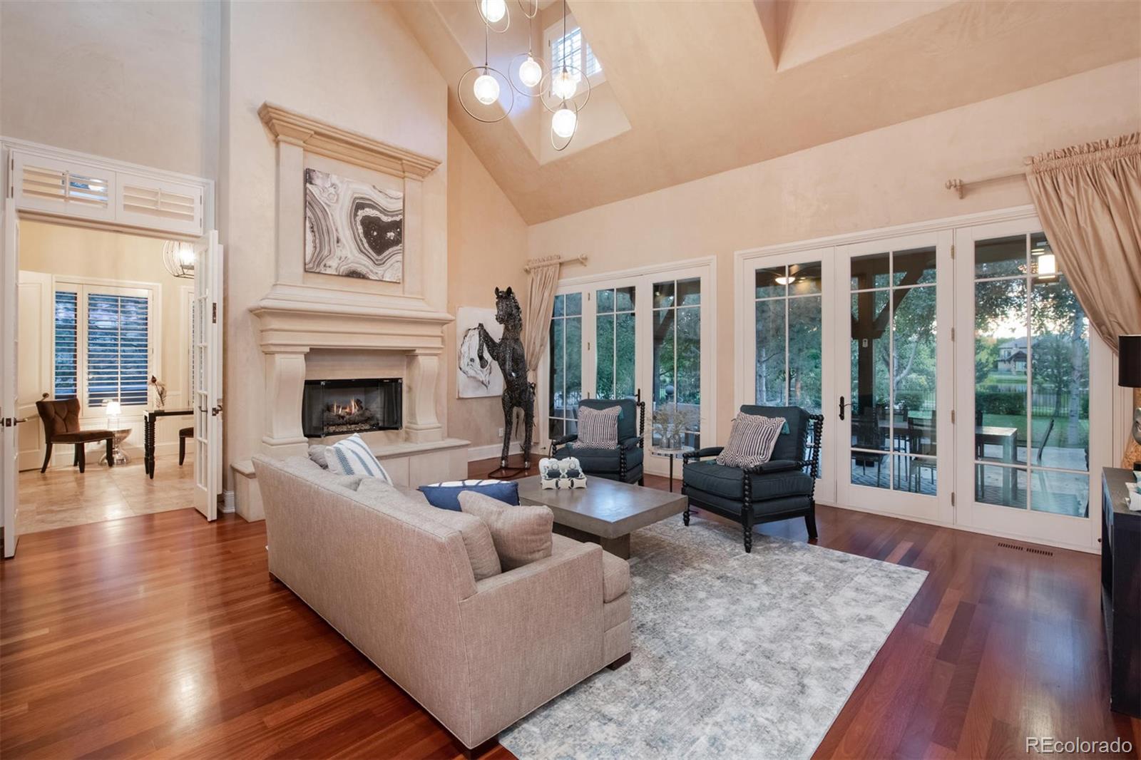 3 Sandy Lake Road Englewood, CO 80113 - Photo 6 of 35 a living room with furniture large window and wooden floor