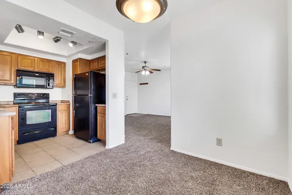 a kitchen with granite countertop a sink and a stove