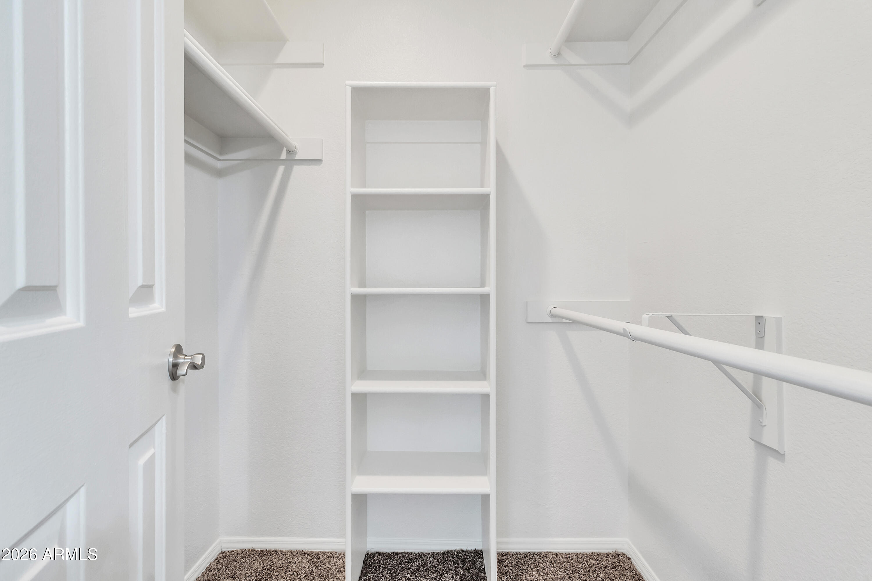 1825 West Ray Road, Unit 2072 Chandler, AZ 85224 - Photo 21 of 47 a view of walk in closet with empty racks
