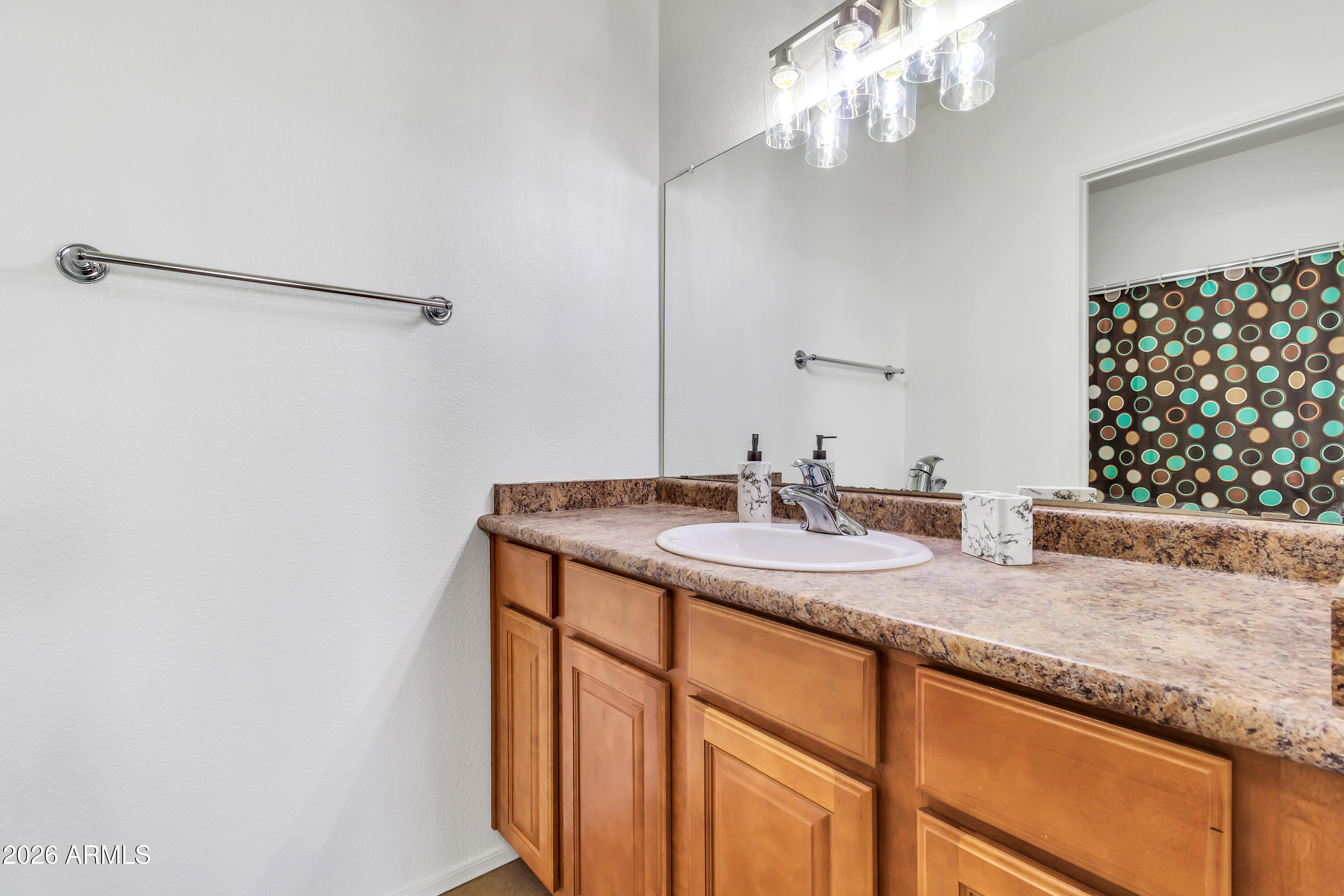 1825 West Ray Road, Unit 2072 Chandler, AZ 85224 - Photo 22 of 47 a bathroom with a granite countertop sink and a mirror