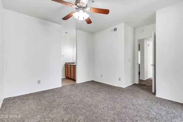 a white toilet sitting next to a shower curtain
