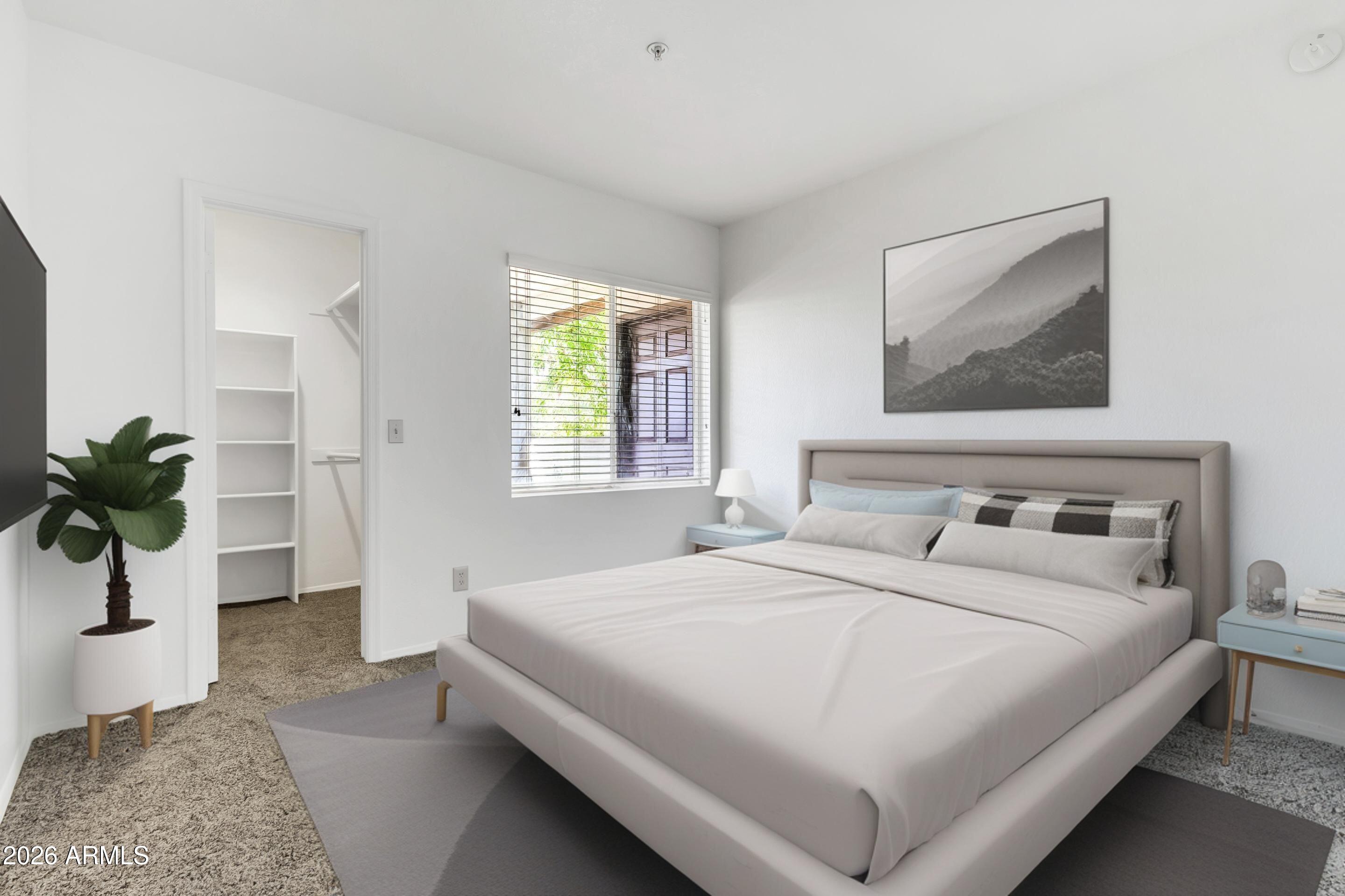 1825 West Ray Road, Unit 2072 Chandler, AZ 85224 - Photo 26 of 47 a bedroom with a bed and a potted plant