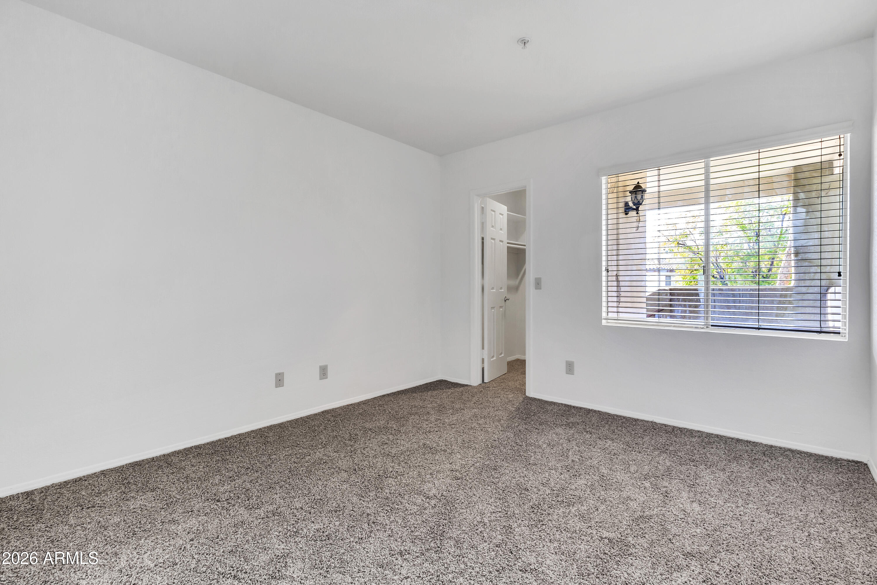 1825 West Ray Road, Unit 2072 Chandler, AZ 85224 - Photo 27 of 47 an empty room with a window