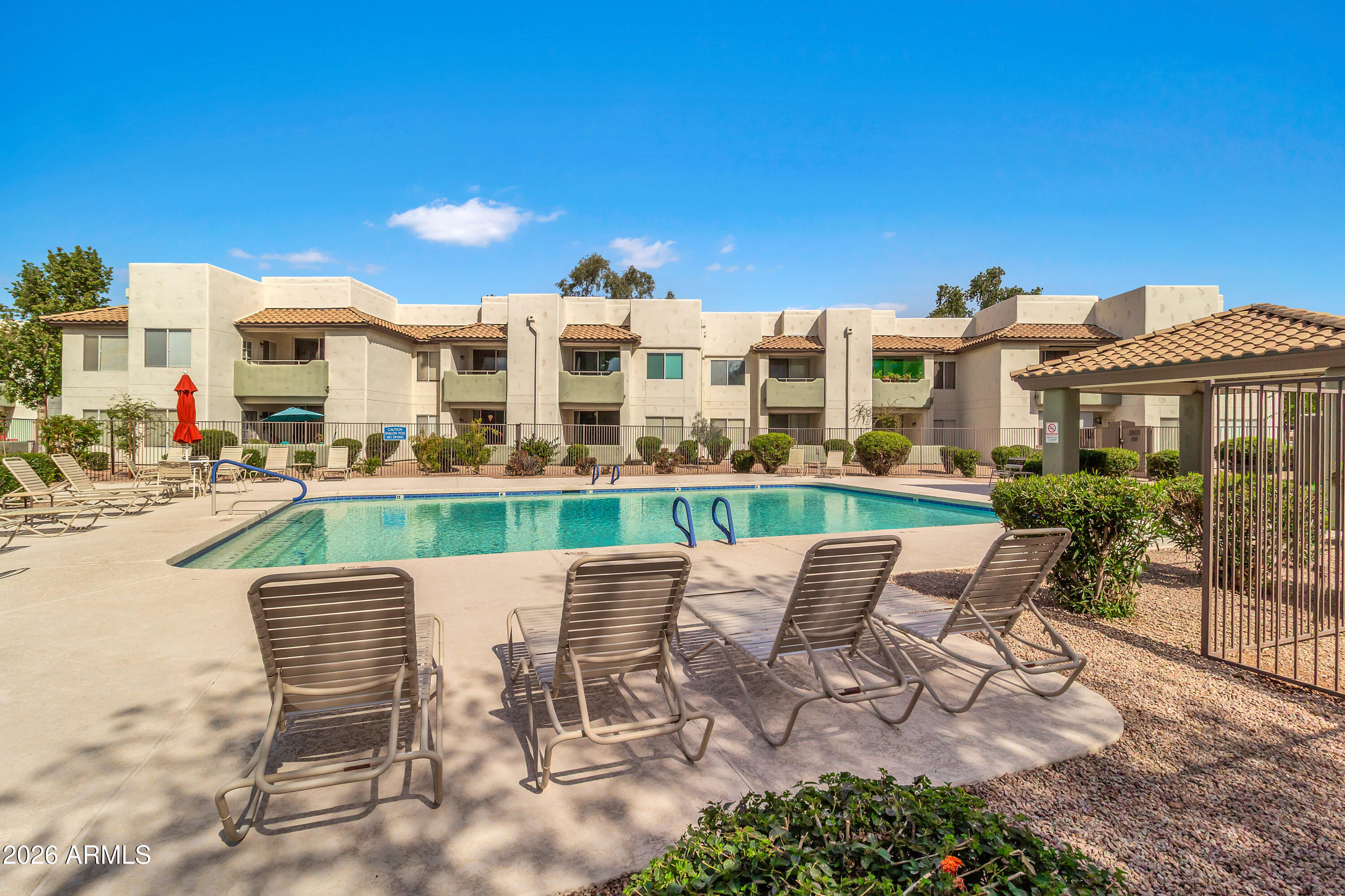 1825 West Ray Road, Unit 2072 Chandler, AZ 85224 - Photo 39 of 47 a view of a chairs and table in the patio