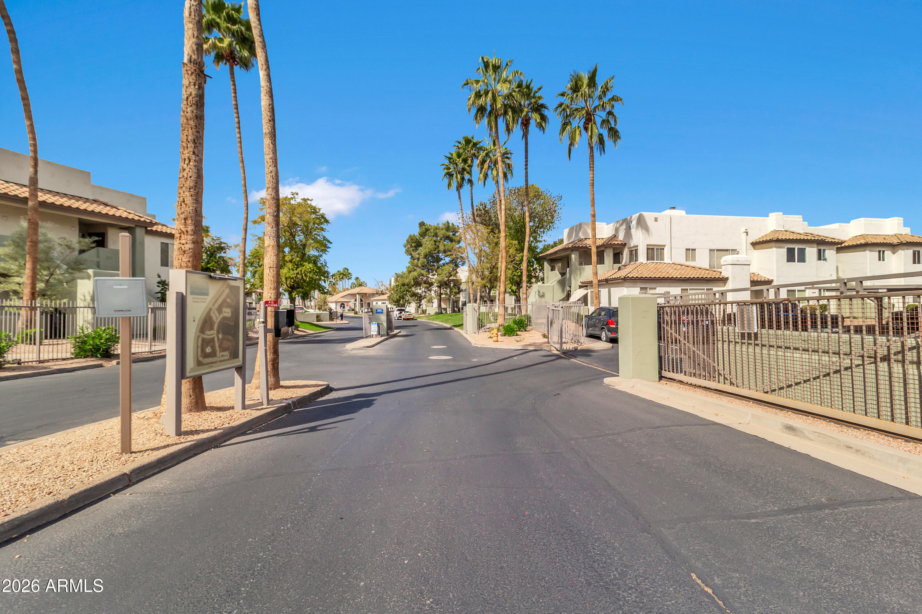 1825 West Ray Road, Unit 2072 Chandler, AZ 85224 - Photo 41 of 47 a view of a street with a building in the background