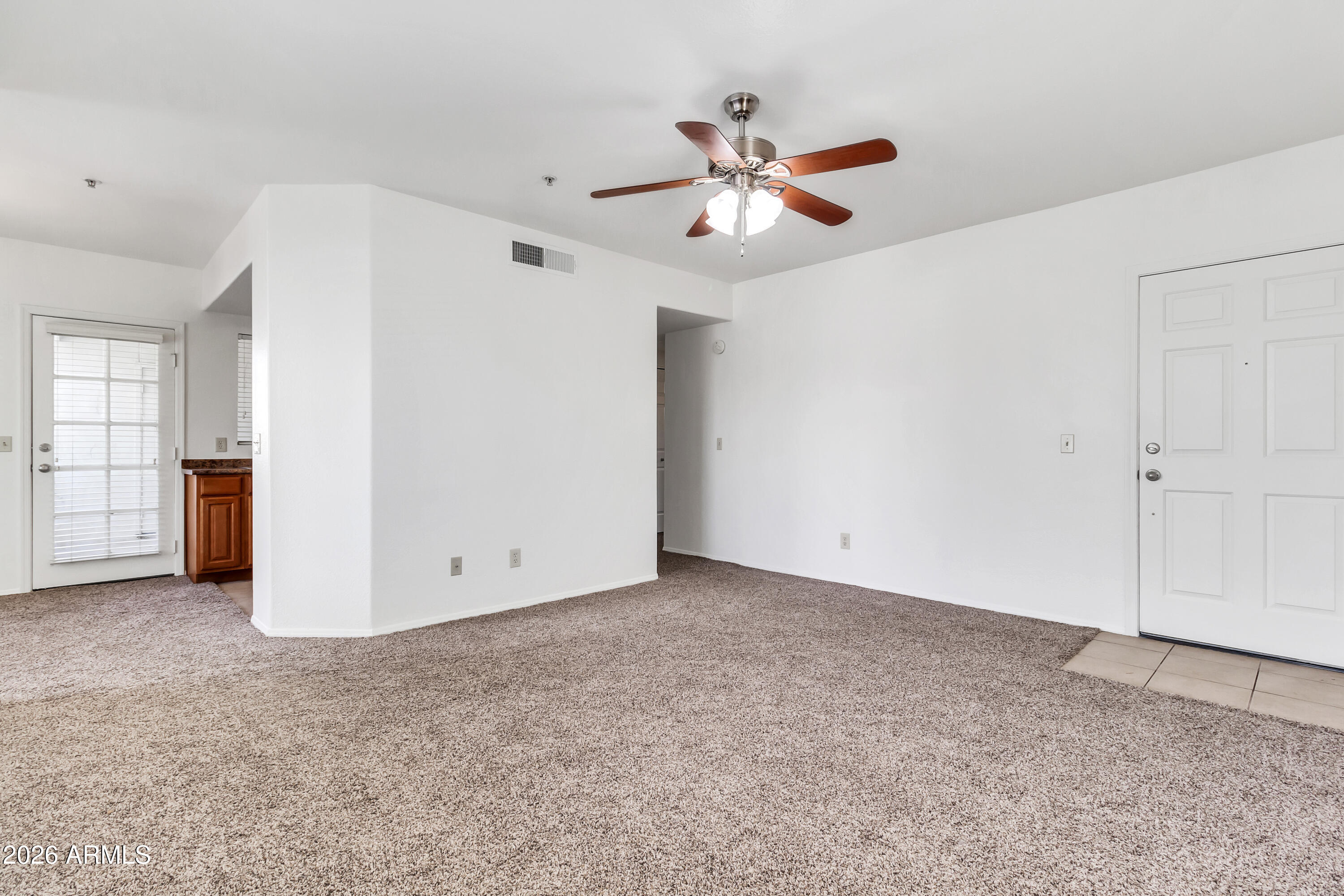 1825 West Ray Road, Unit 2072 Chandler, AZ 85224 - Photo 6 of 47 an empty room with closet and fan