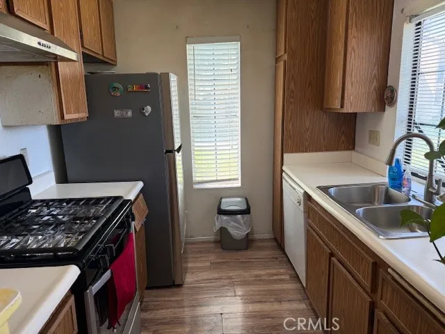 a kitchen that has a sink and a stove