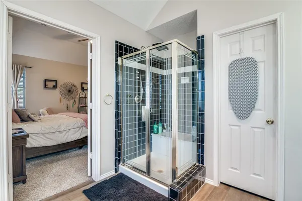 a bedroom with furniture and a window