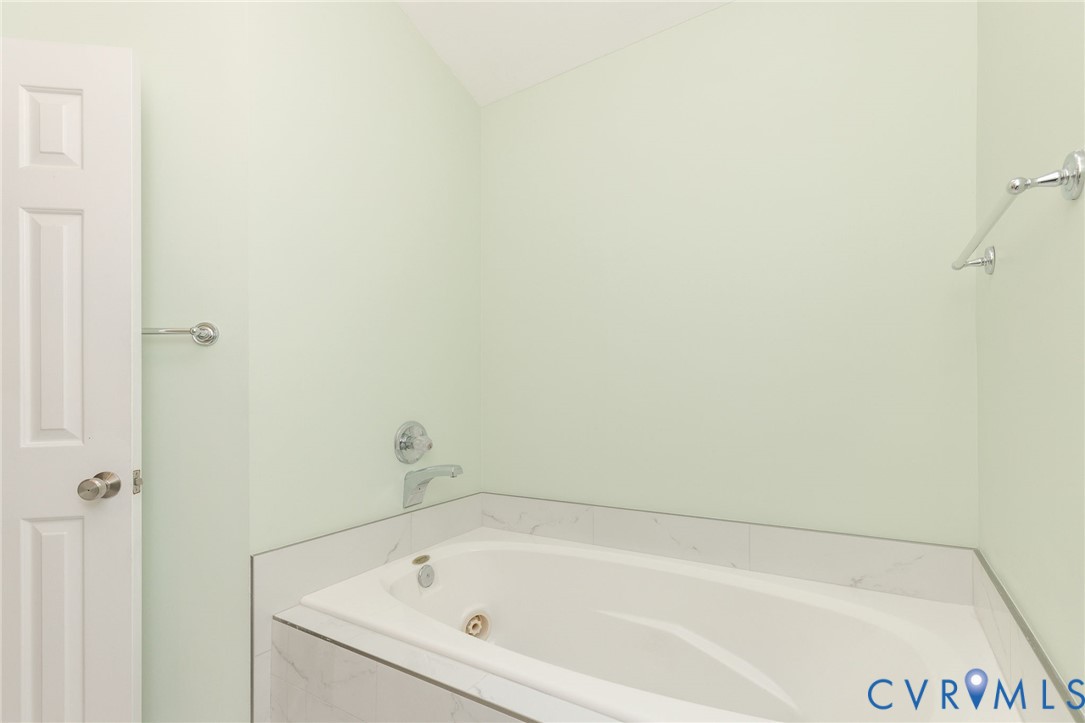 5724 Grove Forest Road Midlothian, VA 23112 - Photo 38 of 47 Built-in jetted tub with a tiled surround, chrome