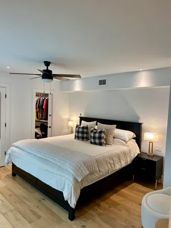 a bedroom with a bed and dresser