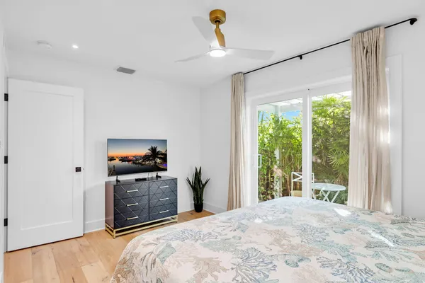 a bedroom with a bed and a dresser