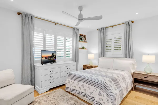 a bedroom with a bed and a couch