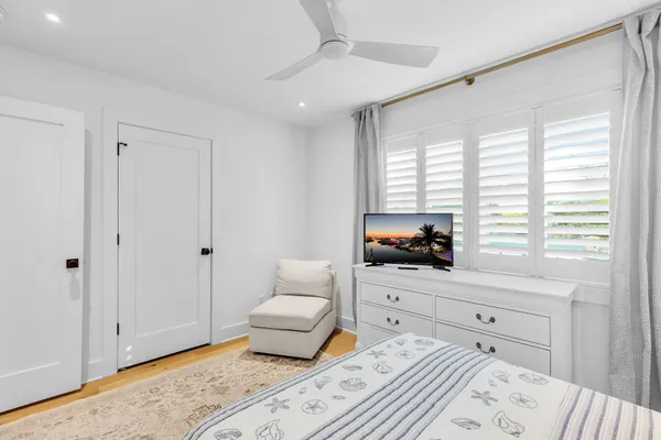 a bathroom with a sink mirror and a shower