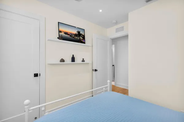 a view of a house with swimming pool and sitting area