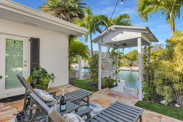 a view of a house with a yard and lake view