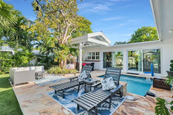 an aerial view of a house with a ocean view