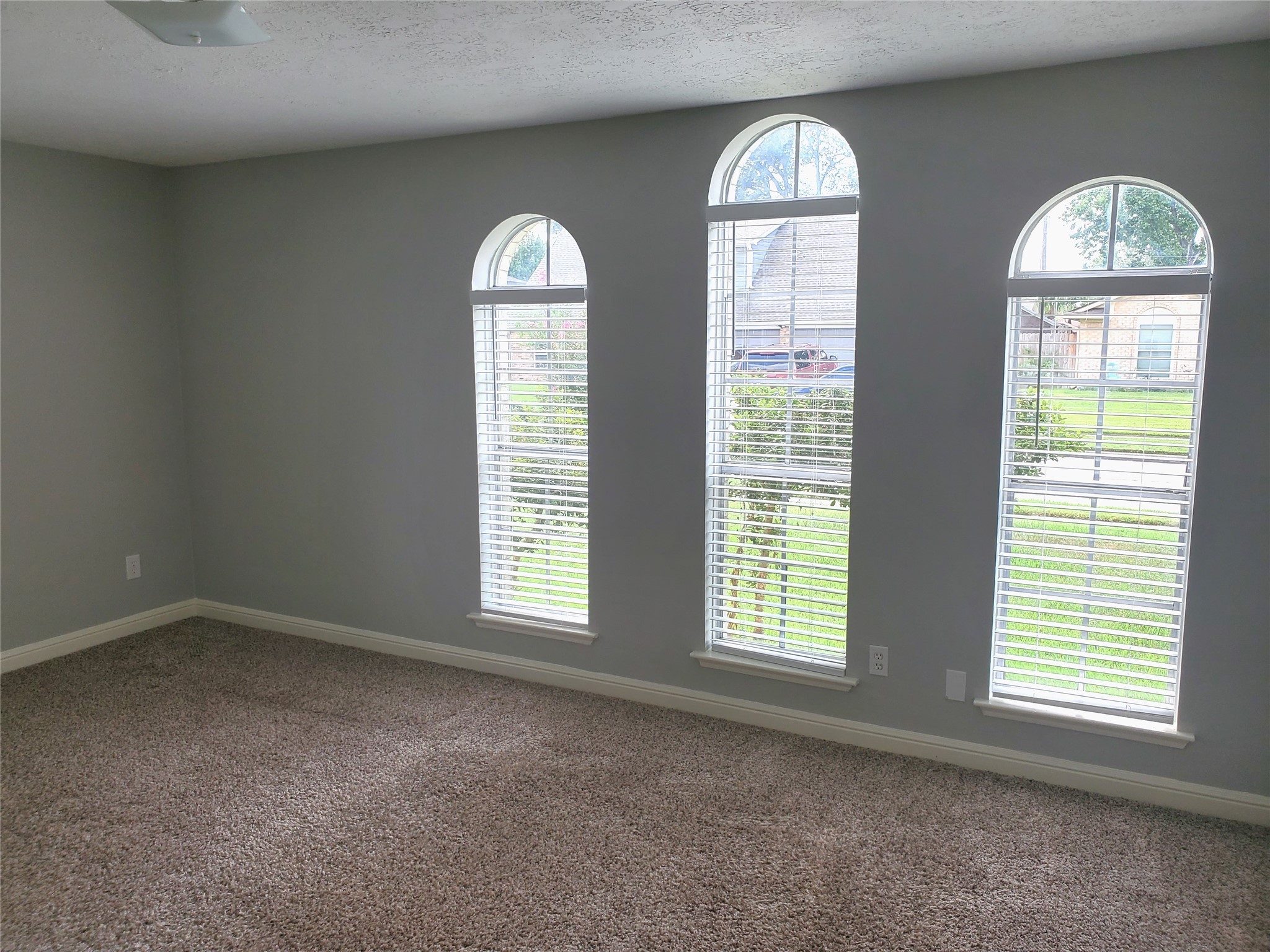 4507 Seneca Street Pasadena, TX 77504 - Photo 12 of 23 an empty room with windows mirror and windows