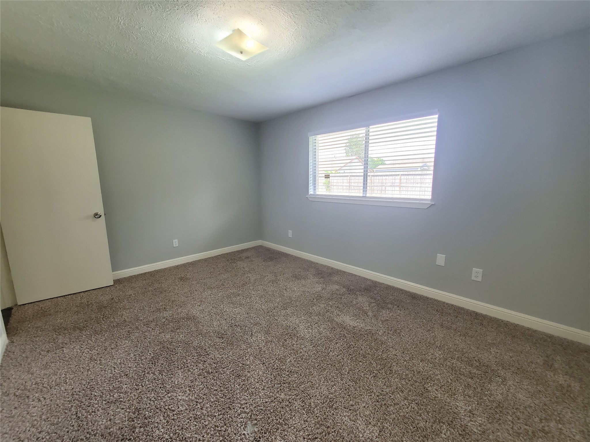 4507 Seneca Street Pasadena, TX 77504 - Photo 21 of 23 an empty room with a window