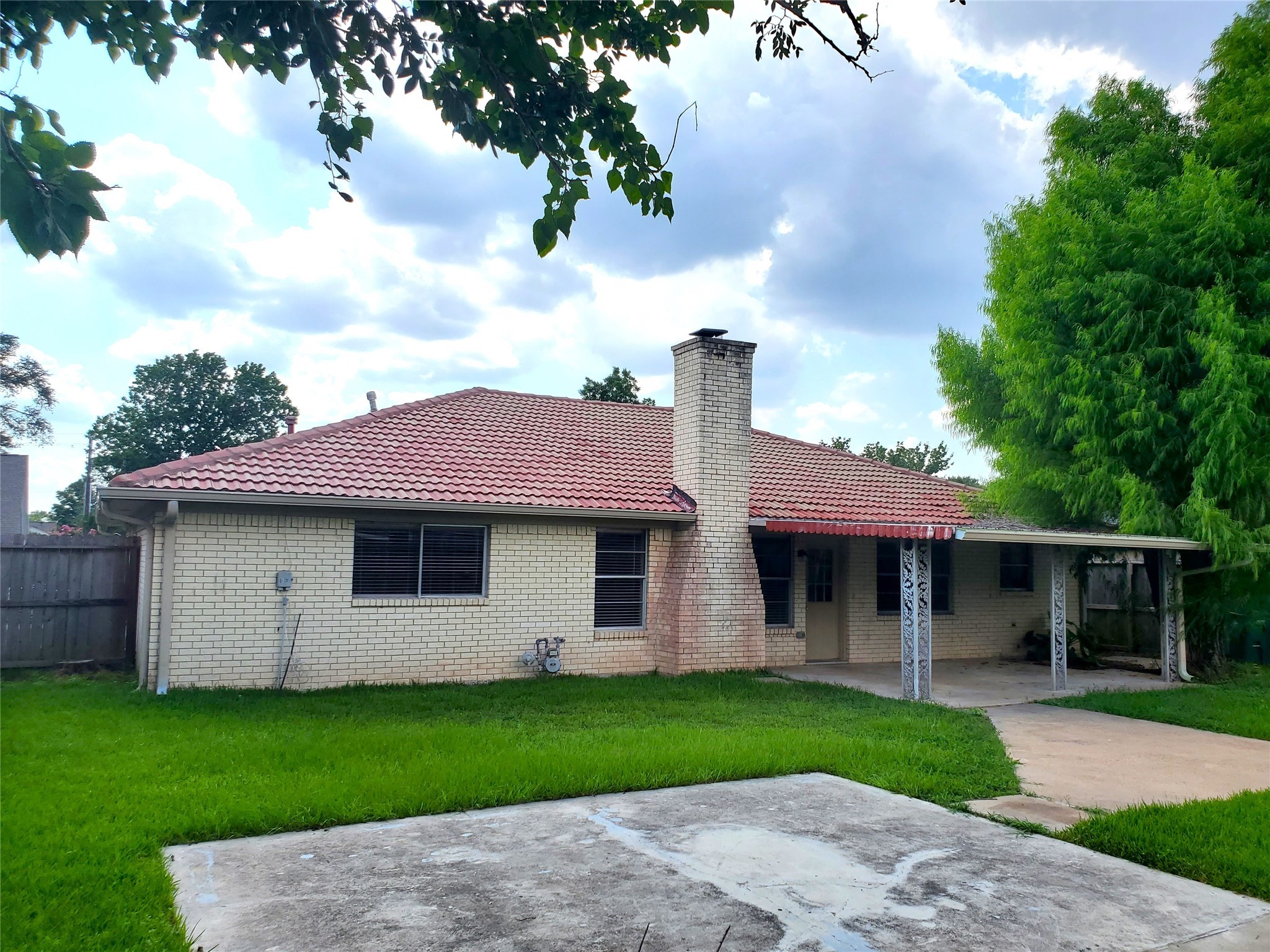 4507 Seneca Street Pasadena, TX 77504 - Photo 22 of 23 a front view of a house with a garden