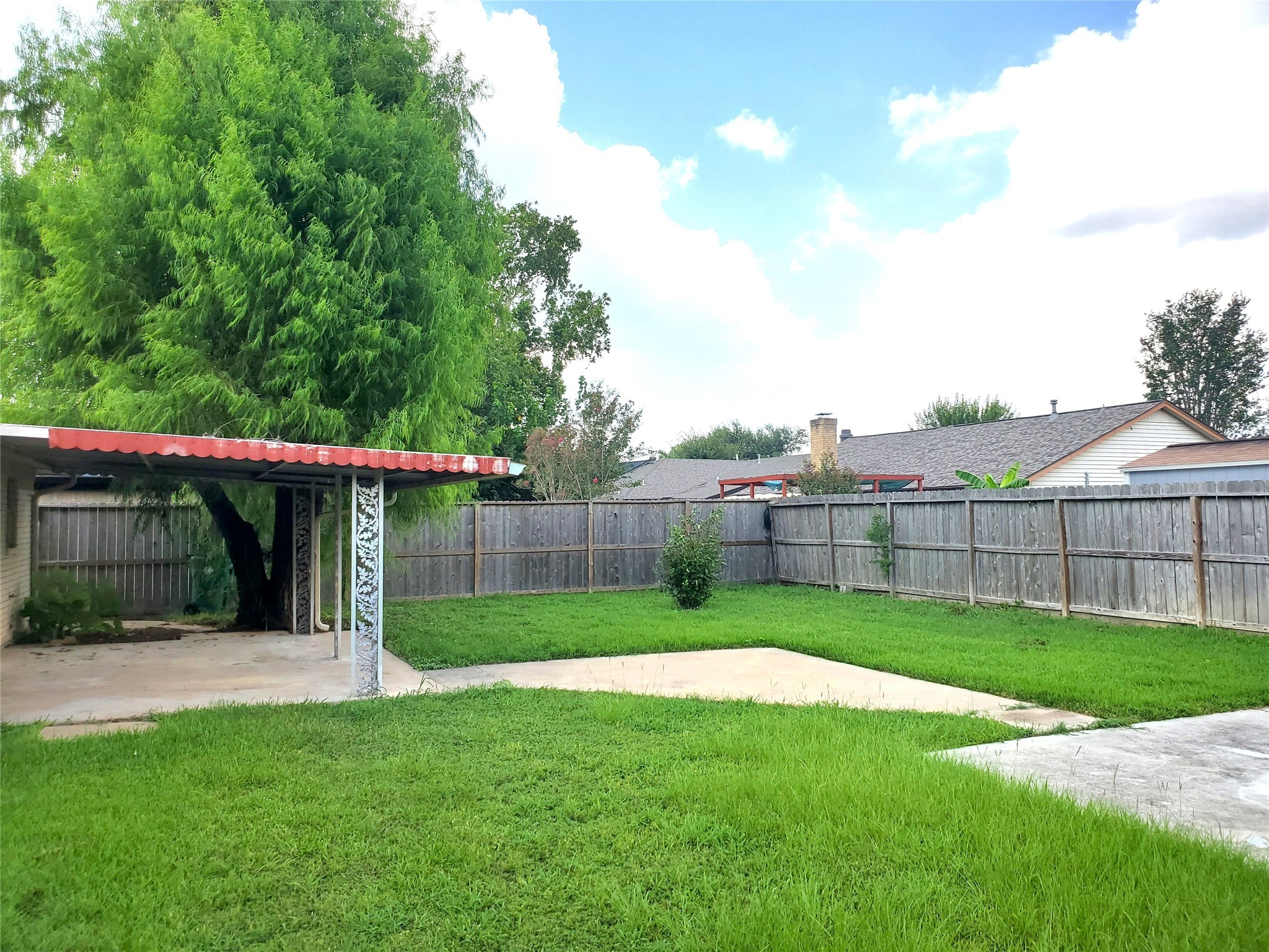 4507 Seneca Street Pasadena, TX 77504 - Photo 23 of 23 a view of a backyard with a garden and plants