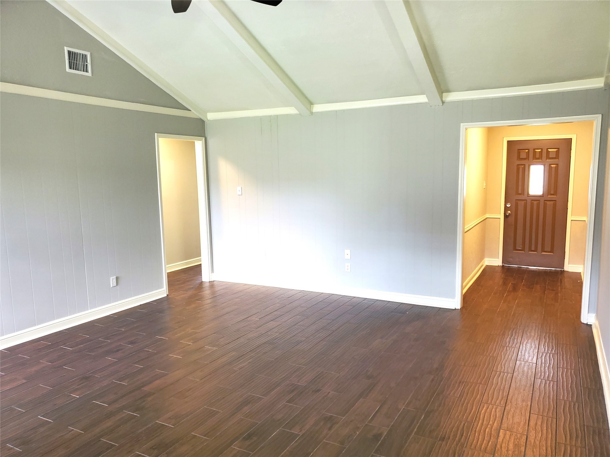 4507 Seneca Street Pasadena, TX 77504 - Photo 3 of 23 a view of an empty room with wooden floor and a window