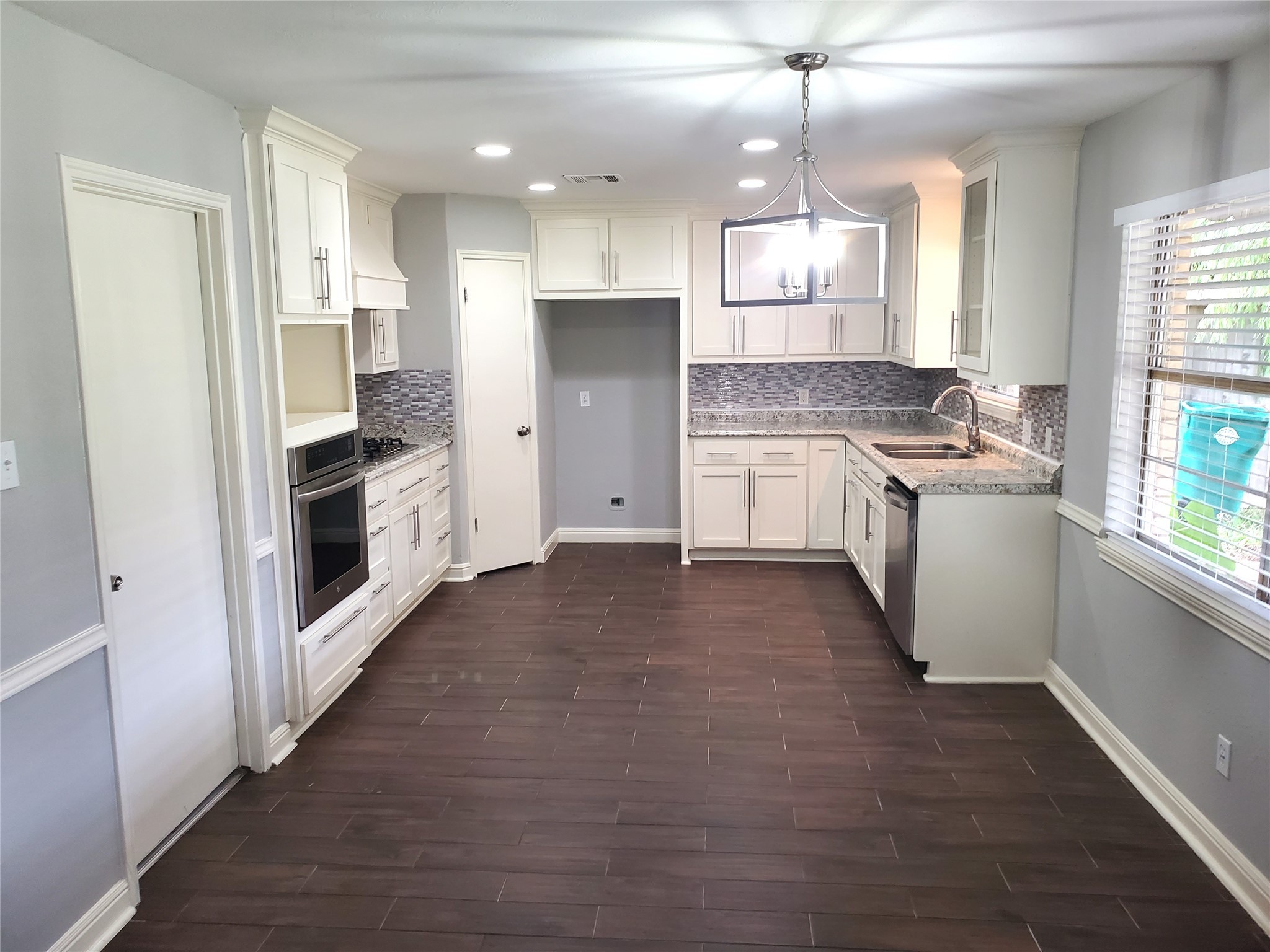 4507 Seneca Street Pasadena, TX 77504 - Photo 6 of 23 a kitchen with a stove a refrigerator and a sink
