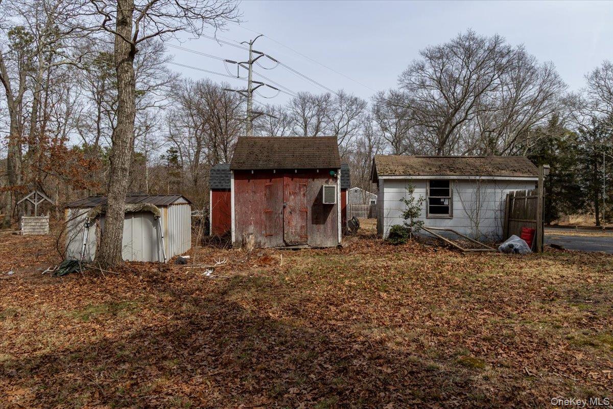 309 Primrose Path Manorville, NY 11949 - Photo 21 of 26 a house view with a backyard space