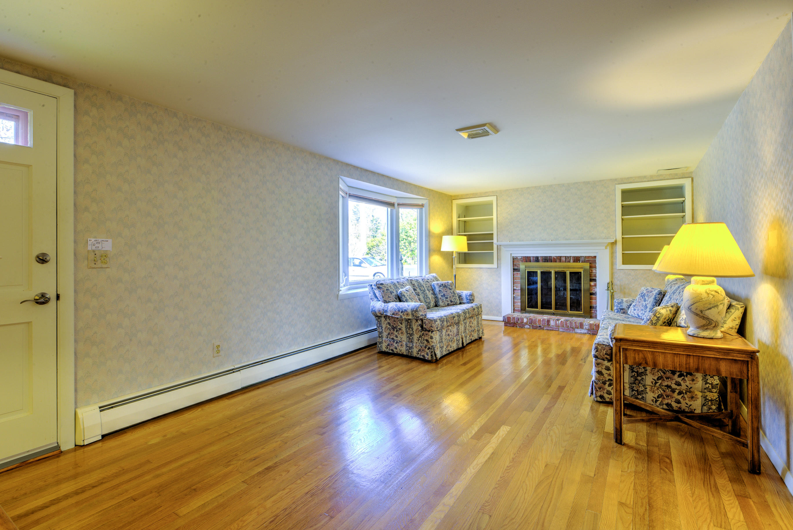 78 Stoney Cliff Road Centerville, MA 02632 - Photo 10 of 35 a living room with furniture and a fireplace